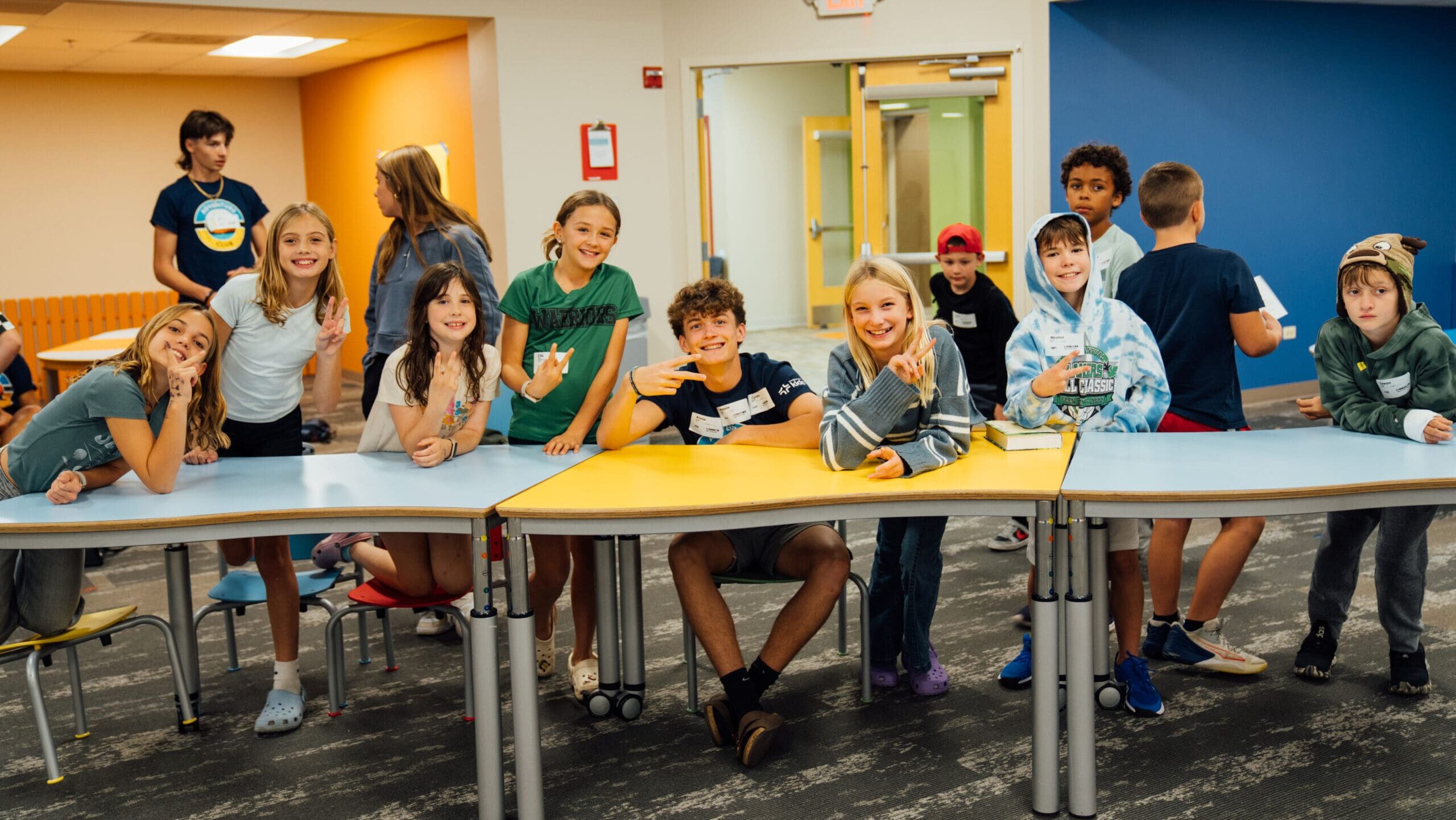 Children and leaders gathered around tables.
